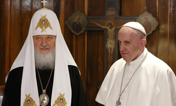 Russian Orthodox Patriarch Kirill of Moscow and Pope Francis pose for photos at the beginning of their meeting at Jose Marti International Airport in Havana Feb. 12. The pope was traveling to Mexico for a six-day pastoral visit. (CNS photo/Paul Haring) See POPE-PATRIARCH-CUBA Feb. 12, 2016.