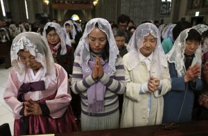 korean-catholics-praying-in-church-with-vails-mantillas