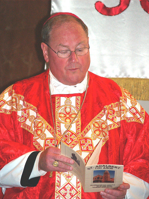 http://the-american-catholic.com/2014/09/18/cardinal-dolan-company-man-iii/