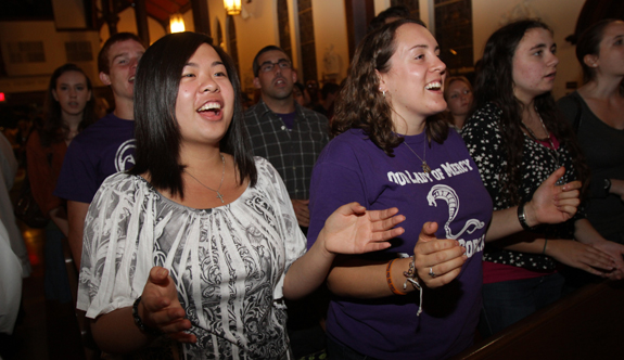 YOUNG WOMEN SING FOLLOWING EUCHARISTIC ADORATION AT NEW YORK CHURCH