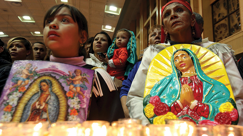 Pilgrims hold up images of Our Lady of Guadalupe during an annual pilgrimage in her honor at the cathedral in Ciudad Juarez, Mexico, Dec. 11. The Vatican announced Dec. 12 that the pope will visit Mexico from Feb. 12-17. His trip will include a stop in Ciudad Juarez, the city across from El Paso, Texas, that is known for drug-related violence. (CNS photo/Jose Luis Gonzalez, Reuters) See POPE-MEXICO-SCHEDULE Dec. 14, 2015.