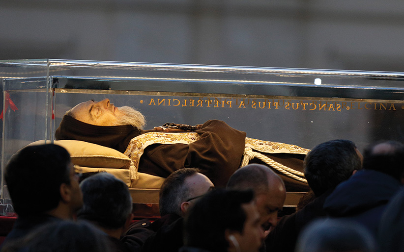 The body of St. Padre Pio is carried in procession in St. Peter's Square at the Vatican Feb. 5. Pope Francis had asked that the relics of Padre Pio and St. Leopold Mandic, both Capuchins, be brought to Rome for the Year of Mercy. (CNS photo/Paul Haring) See POPE-PADRE-PIO-LEOPOLD Feb 6, 2016 and PADRE-PIO-LEOPOLD-MERCY Feb. 4, 2016.