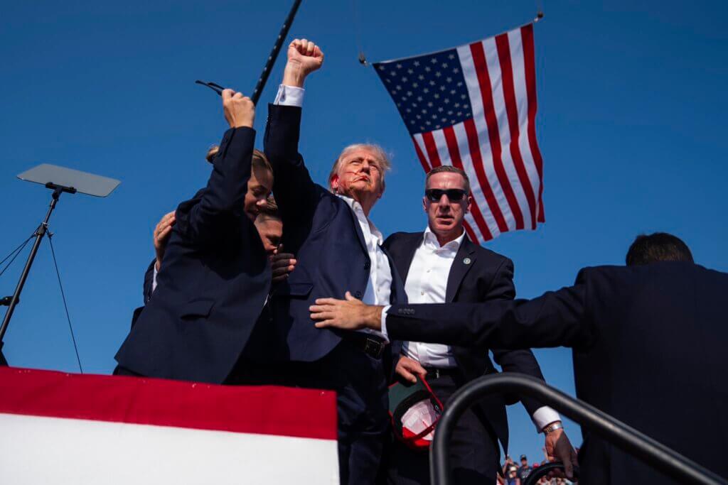 Trump Pumps His Fist in Defiance After Failed Assassination Attempt by Evan Vucci